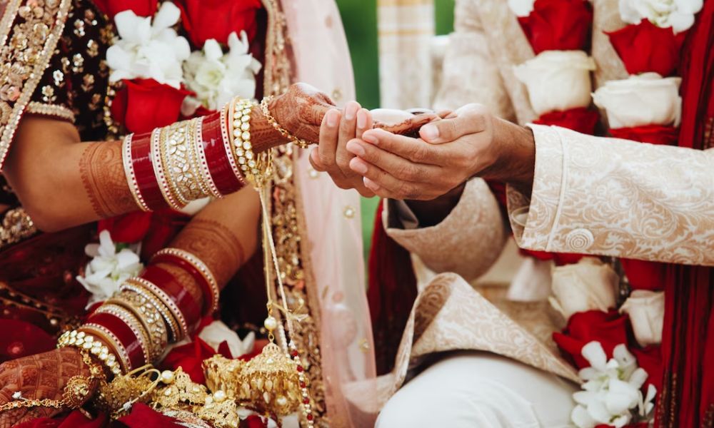 A couple holding hands during their wedding ceremony