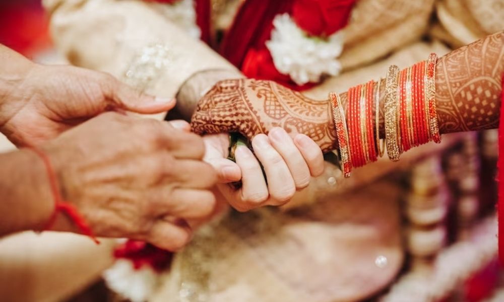 A bride and groom holding hands together